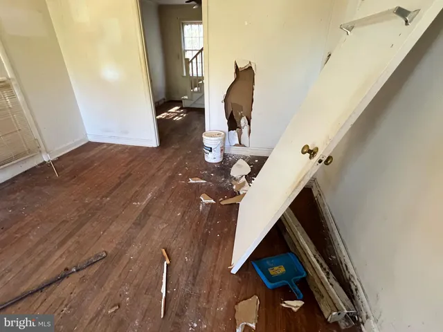 a view of living room with furniture and a fireplace