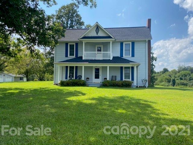 115 Amble Road Olin, NC 28660 - Photo 1 of 47 a front view of a house with a garden