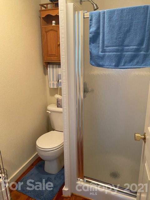 115 Amble Road Olin, NC 28660 - Photo 13 of 47 a bathroom with a toilet and a shower