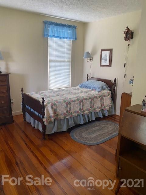 115 Amble Road Olin, NC 28660 - Photo 14 of 47 a bedroom with a bed and a dresser