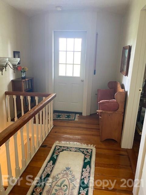 115 Amble Road Olin, NC 28660 - Photo 17 of 47 a hallway with furniture and wooden floor