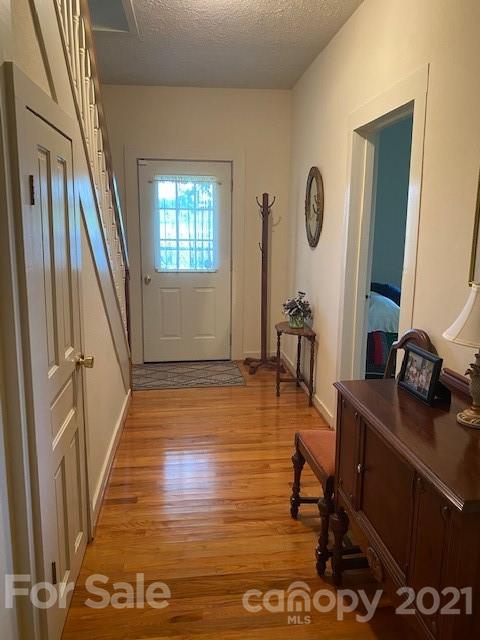 115 Amble Road Olin, NC 28660 - Photo 19 of 47 a room with wooden floor and furniture