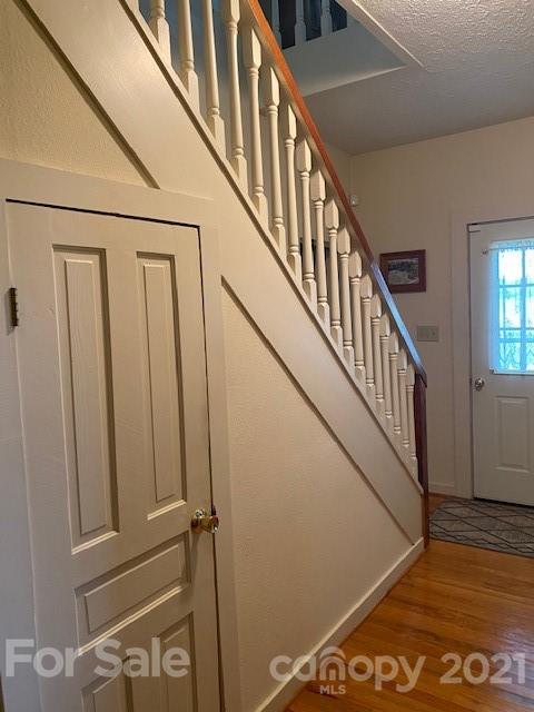 115 Amble Road Olin, NC 28660 - Photo 20 of 47 a view of staircase with lots of frames on wall and a window