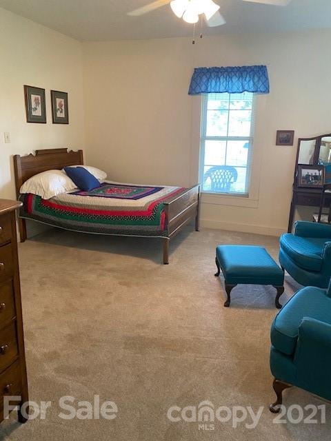 115 Amble Road Olin, NC 28660 - Photo 3 of 47 a bedroom with furniture and a window
