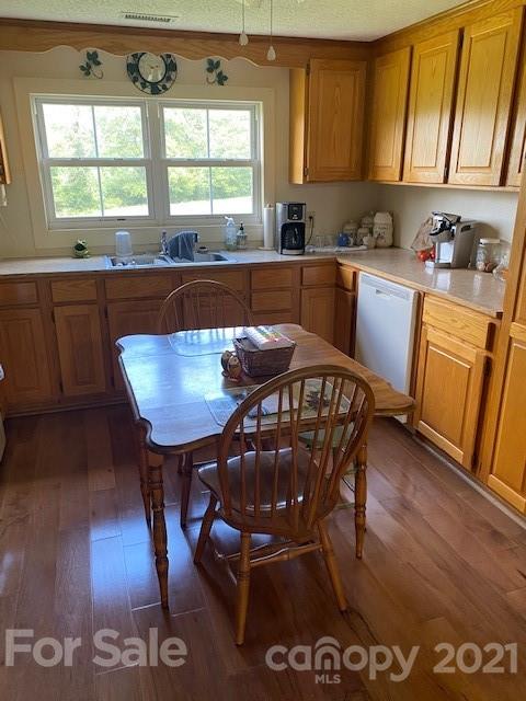 115 Amble Road Olin, NC 28660 - Photo 25 of 47 a kitchen with stainless steel appliances granite countertop a sink a stove a dining table and chairs