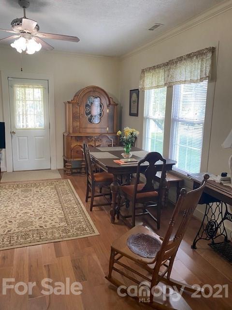 115 Amble Road Olin, NC 28660 - Photo 28 of 47 a living room with furniture a chandelier and a window