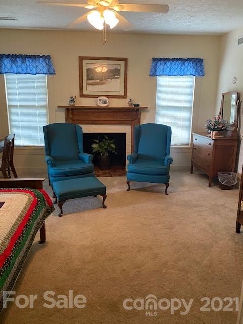 115 Amble Road Olin, NC 28660 - Photo 4 of 47 a living room with furniture and a fireplace