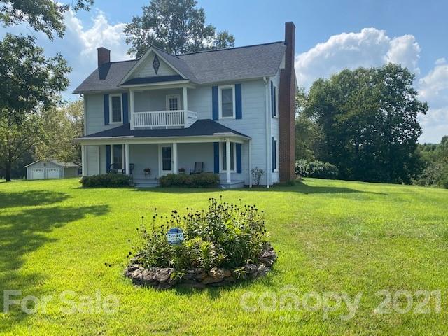 115 Amble Road Olin, NC 28660 - Photo 34 of 47 a front view of a house with a yard