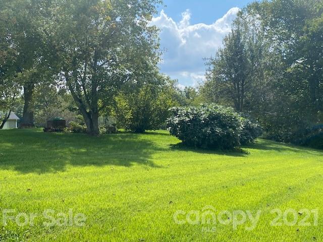 115 Amble Road Olin, NC 28660 - Photo 39 of 47 a view of a yard with a house in the background