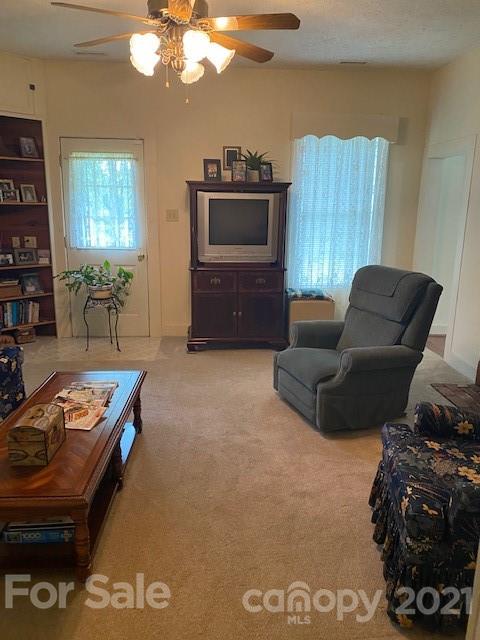 115 Amble Road Olin, NC 28660 - Photo 5 of 47 a living room with furniture and a flat screen tv