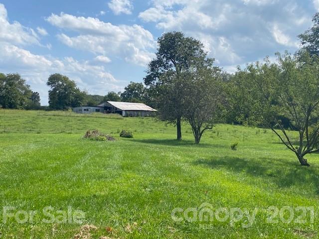 115 Amble Road Olin, NC 28660 - Photo 43 of 47 a view of outdoor space with deck and yard