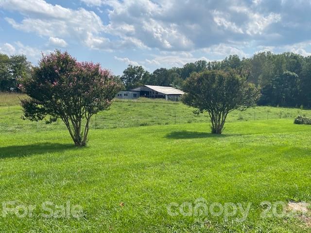 115 Amble Road Olin, NC 28660 - Photo 46 of 47 a view of grassy field with trees