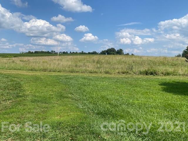115 Amble Road Olin, NC 28660 - Photo 47 of 47 a view of a lake with a city