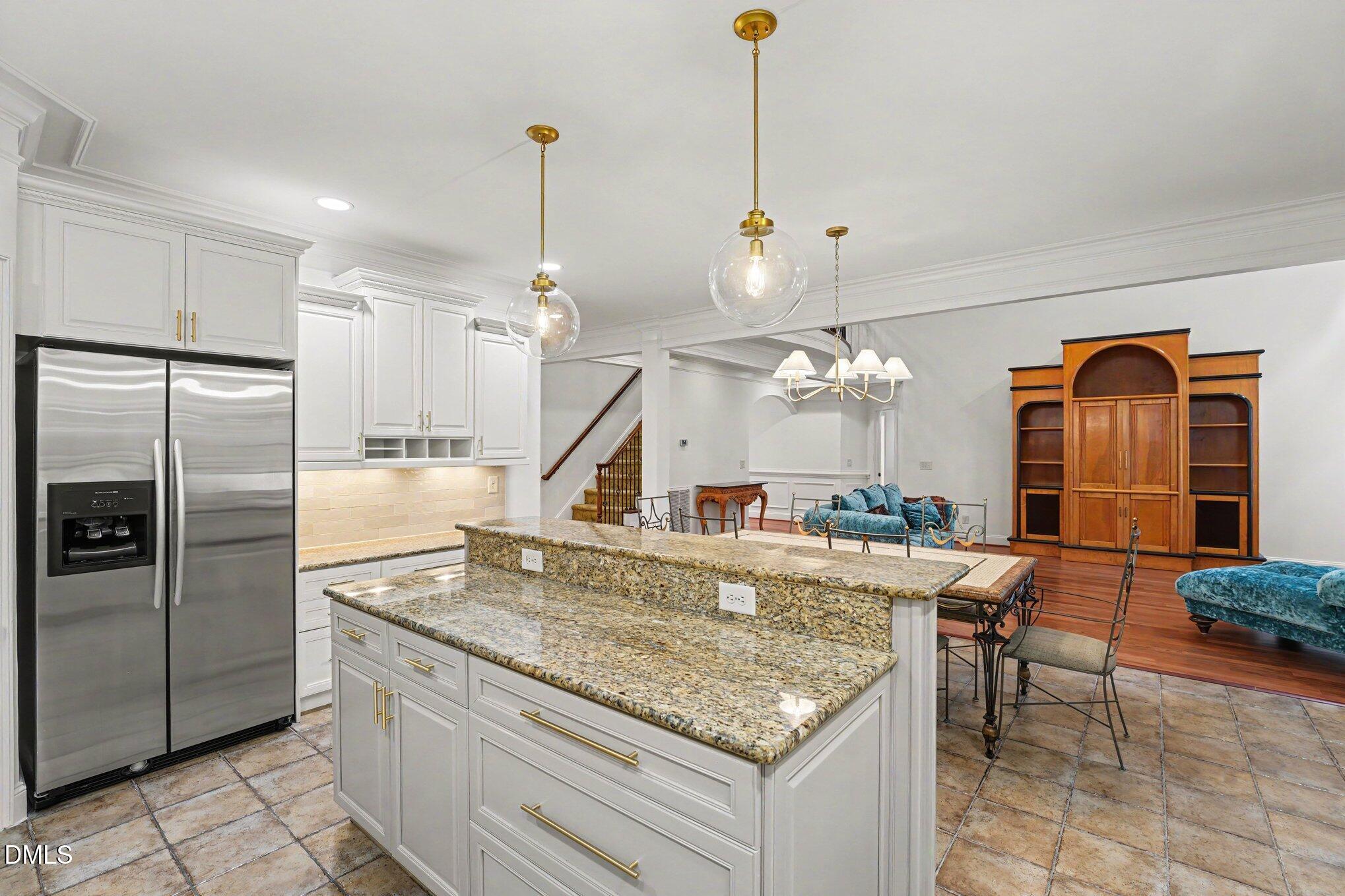 1729 Frenchwood Drive Raleigh, NC 27612 - Photo 7 of 46 a kitchen with stainless steel appliances granite countertop a sink a stove and a refrigerator