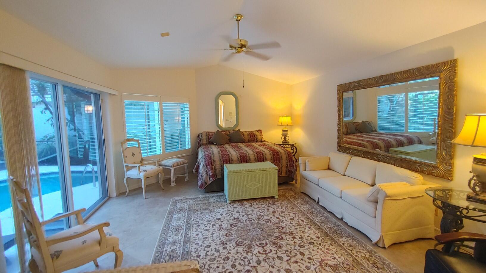 16461 Riverwind Drive Jupiter, FL 33477 - Photo 19 of 45 a living room with furniture and a large window