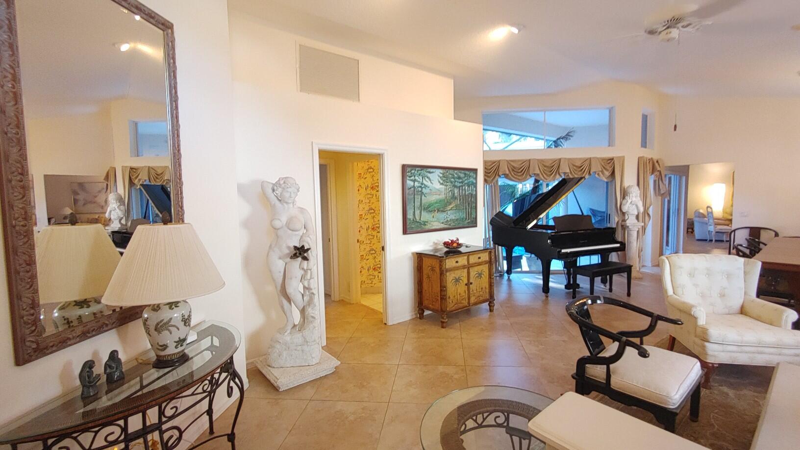 16461 Riverwind Drive Jupiter, FL 33477 - Photo 2 of 45 a living room with furniture