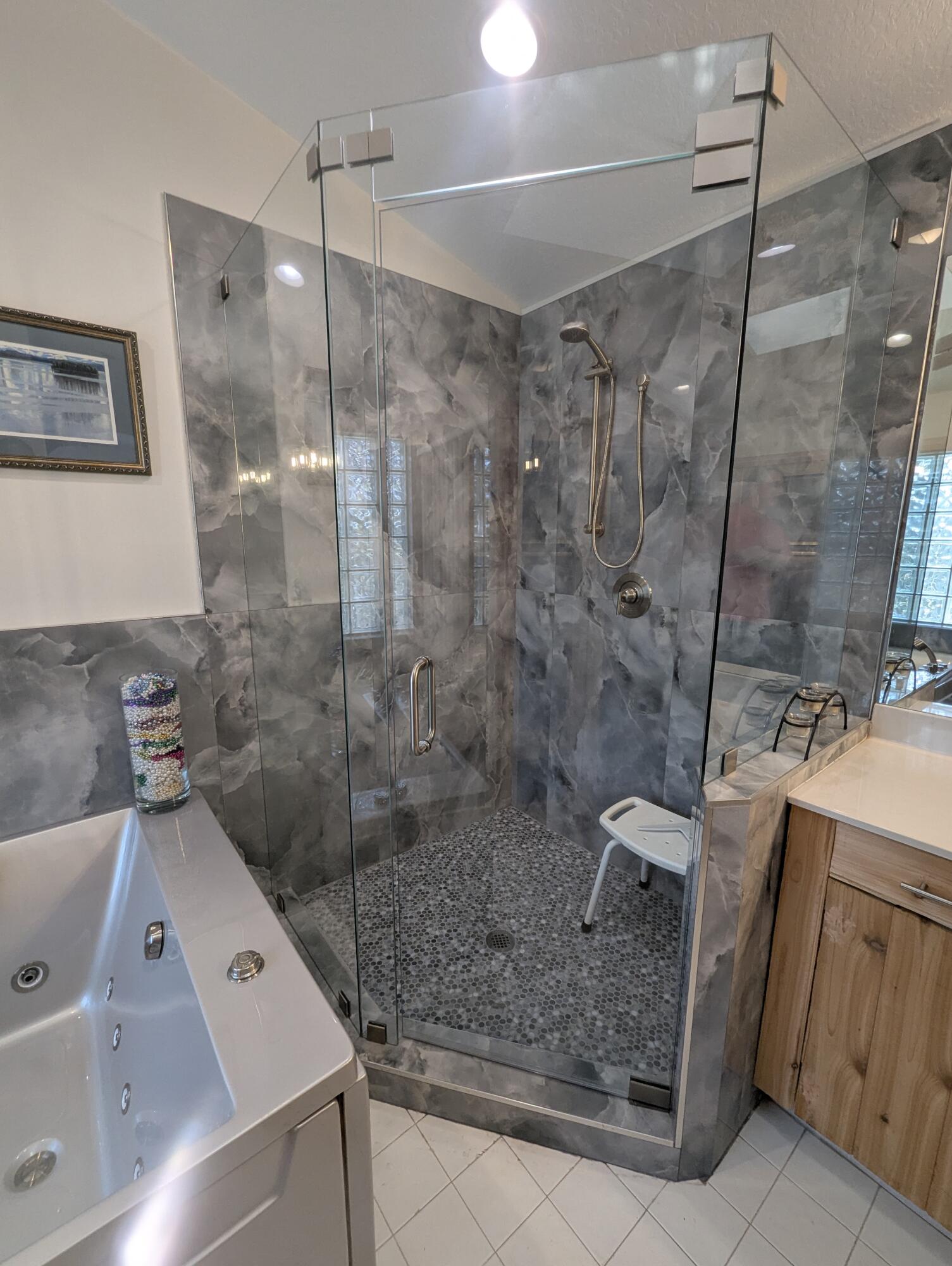 16461 Riverwind Drive Jupiter, FL 33477 - Photo 26 of 45 a bathroom with a shower and a sink