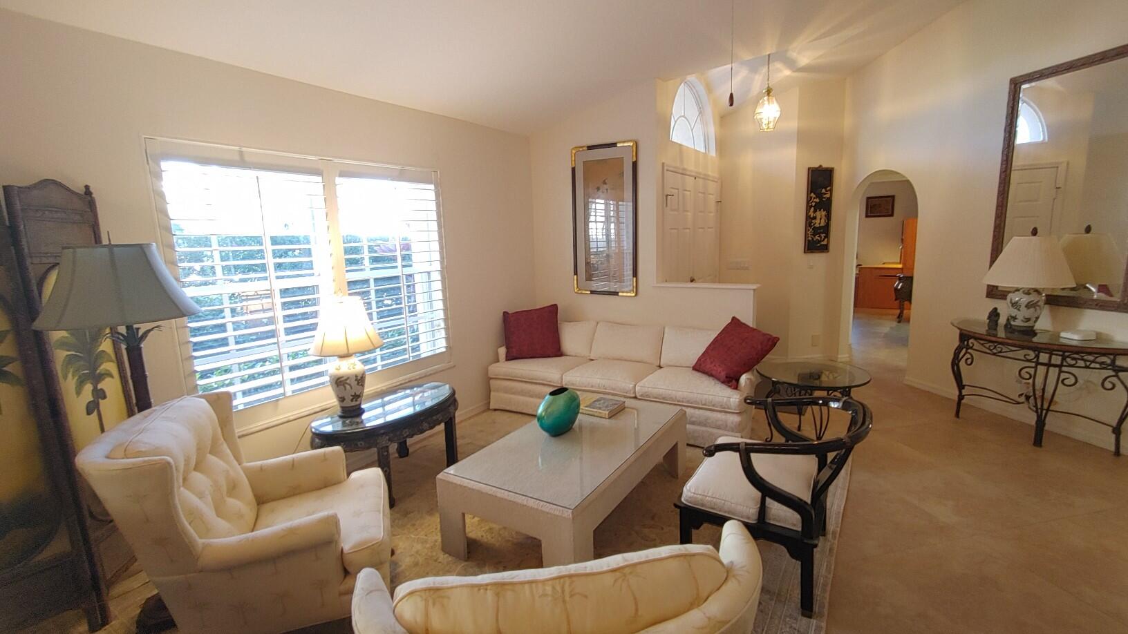 16461 Riverwind Drive Jupiter, FL 33477 - Photo 3 of 45 a living room with furniture and a large window