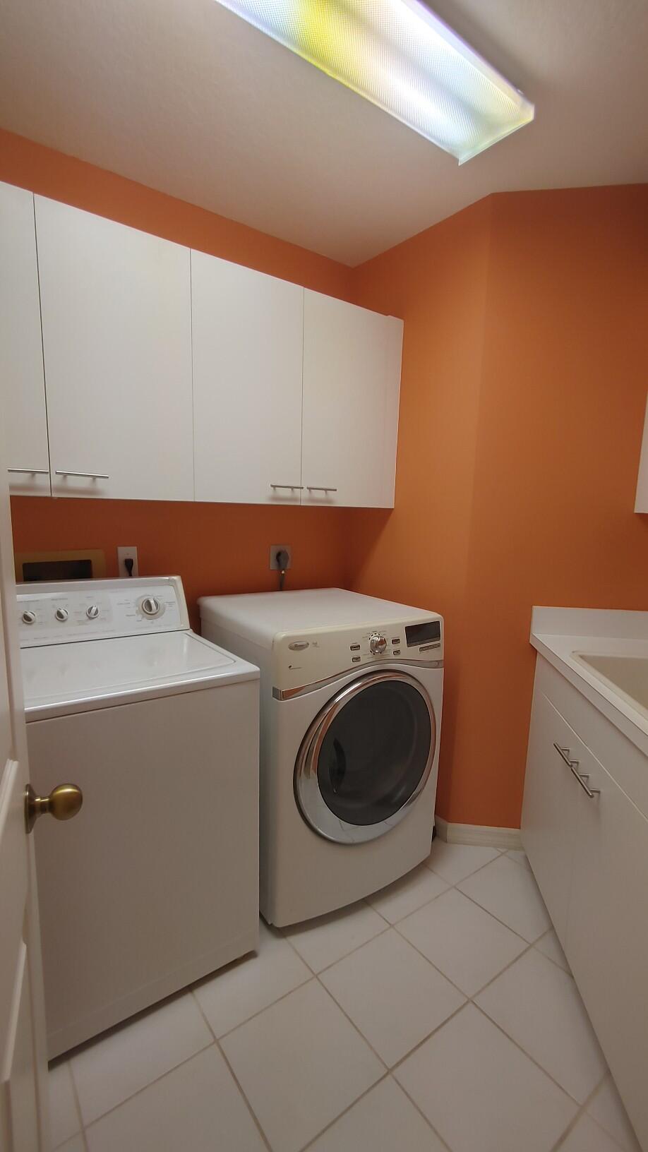 16461 Riverwind Drive Jupiter, FL 33477 - Photo 33 of 45 a utility room with dryer and washer