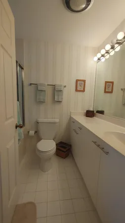 a bathroom with a mirror and a shower