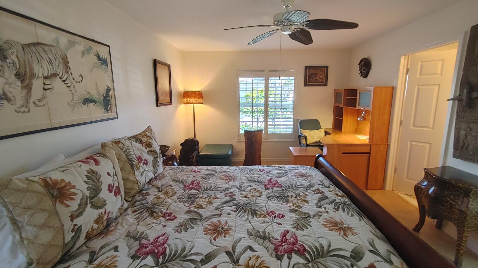 16461 Riverwind Drive Jupiter, FL 33477 - Photo 38 of 45 a bed room with a bed and a furniture
