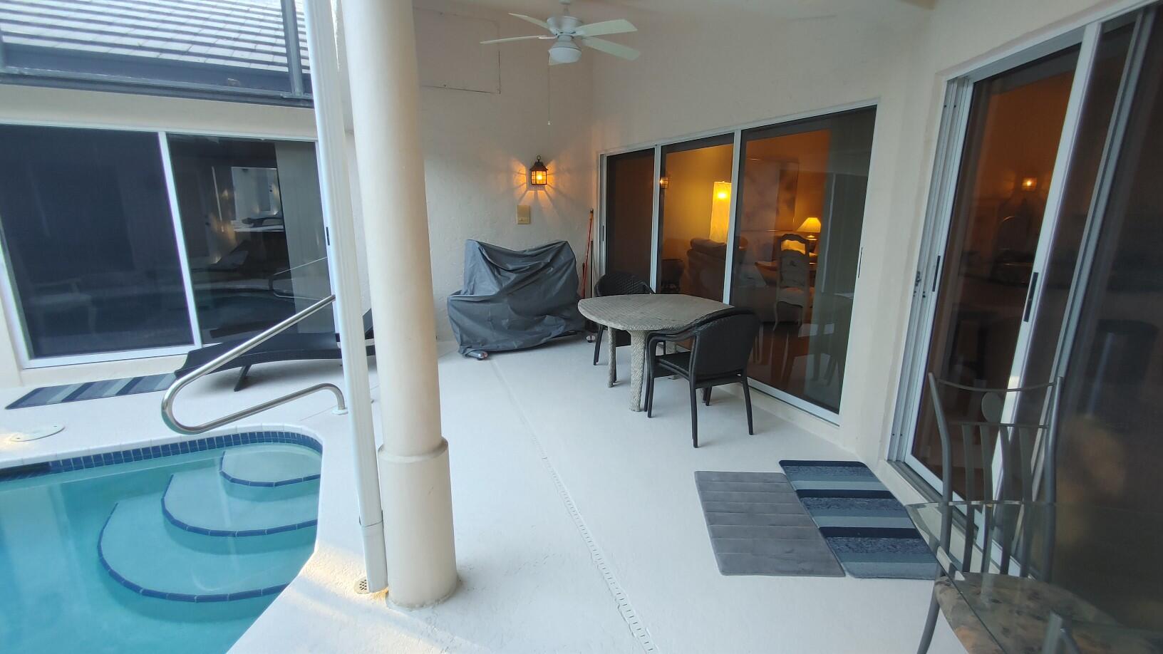 16461 Riverwind Drive Jupiter, FL 33477 - Photo 43 of 45 a view of entryway and hall with wooden floor