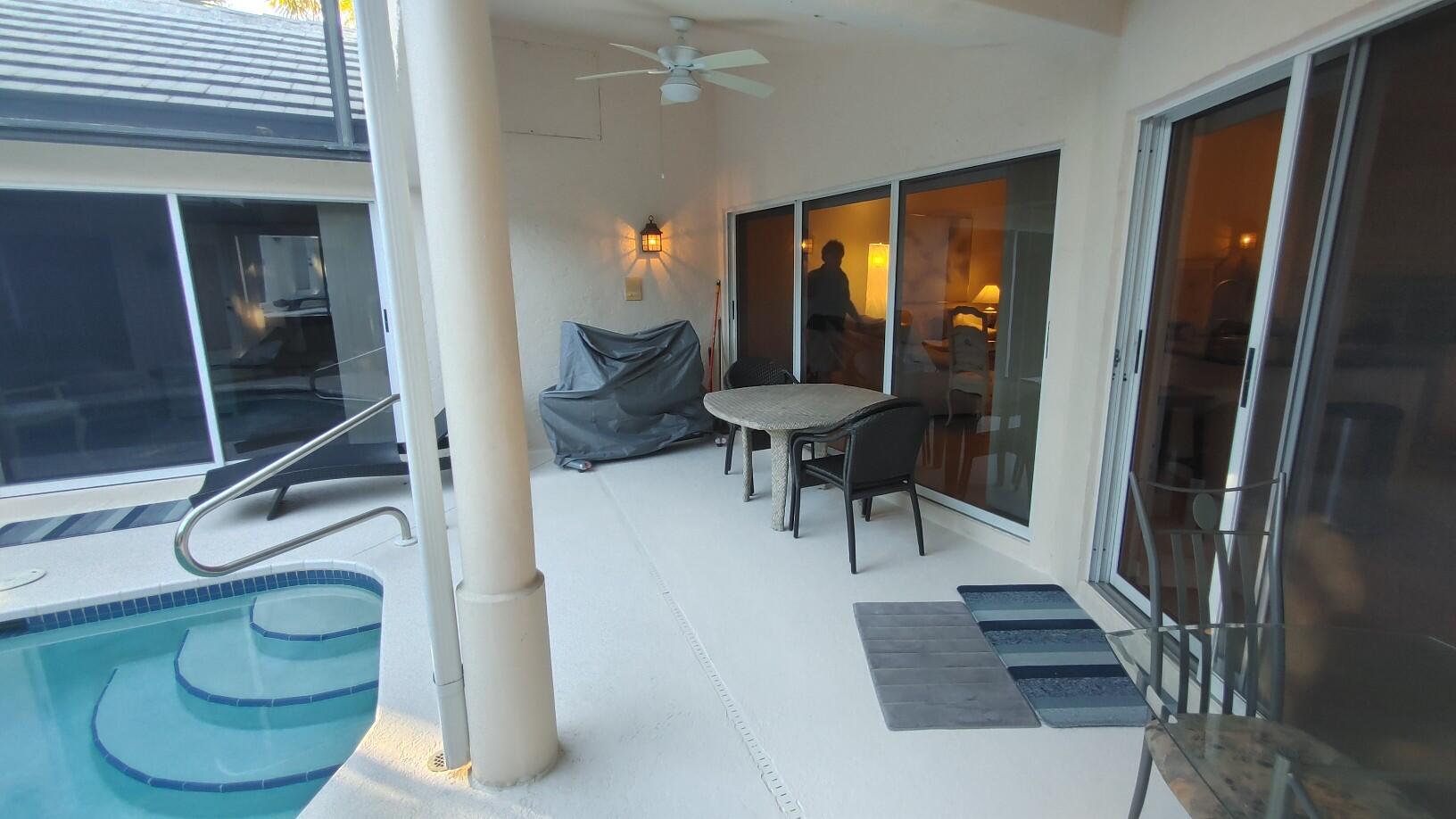 16461 Riverwind Drive Jupiter, FL 33477 - Photo 44 of 45 a view of entryway and hall with wooden floor