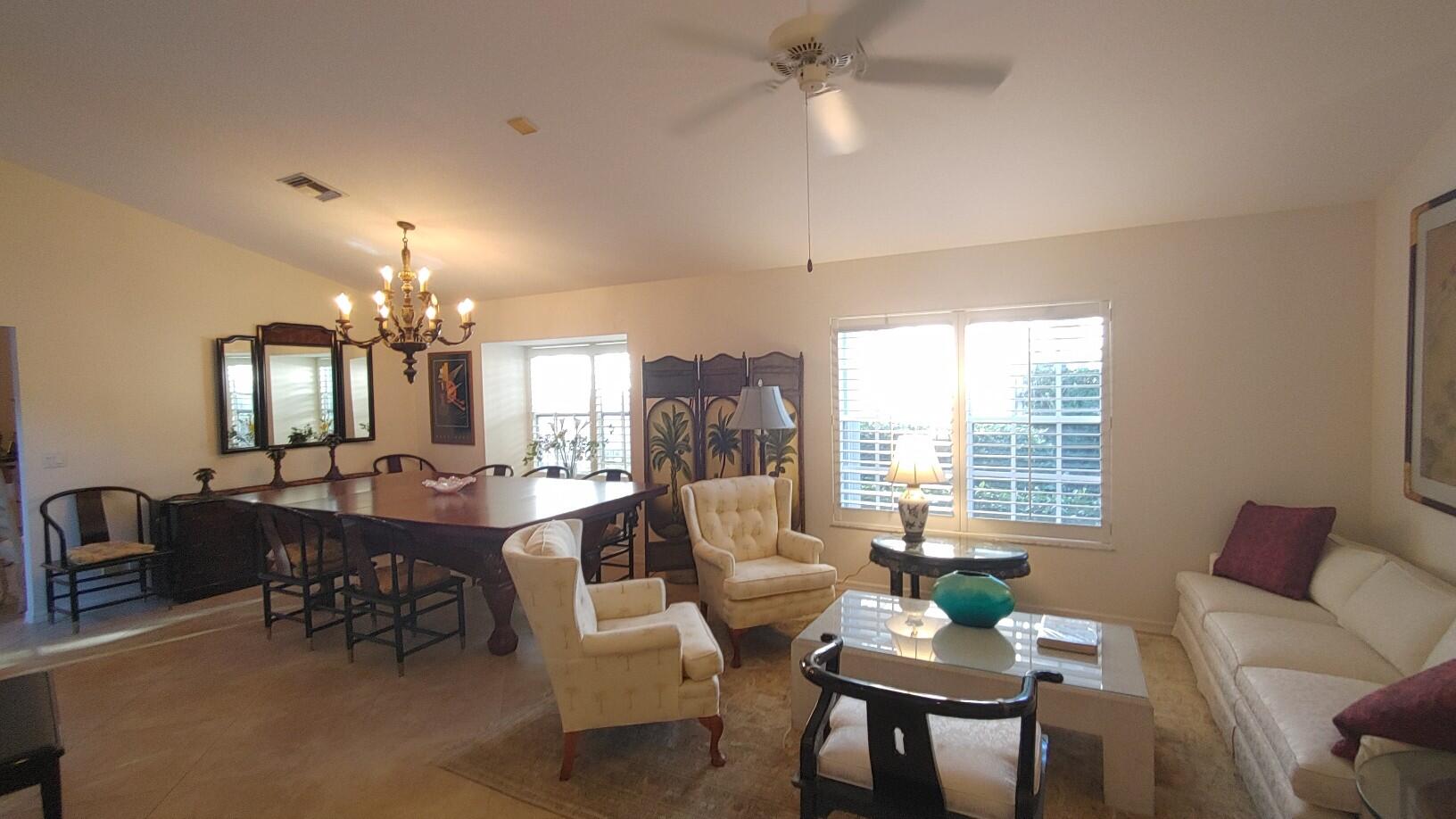 16461 Riverwind Drive Jupiter, FL 33477 - Photo 7 of 45 a view of a dining room with furniture and window