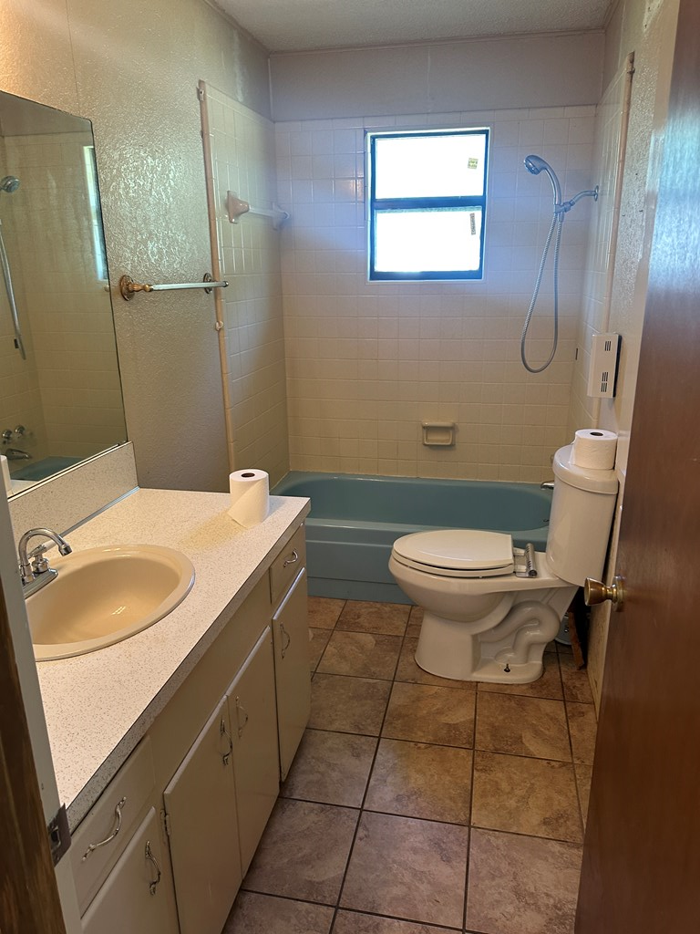 104 South Ave B Mason, TX 76856 - Photo 13 of 26 a bathroom with a sink a toilet and shower