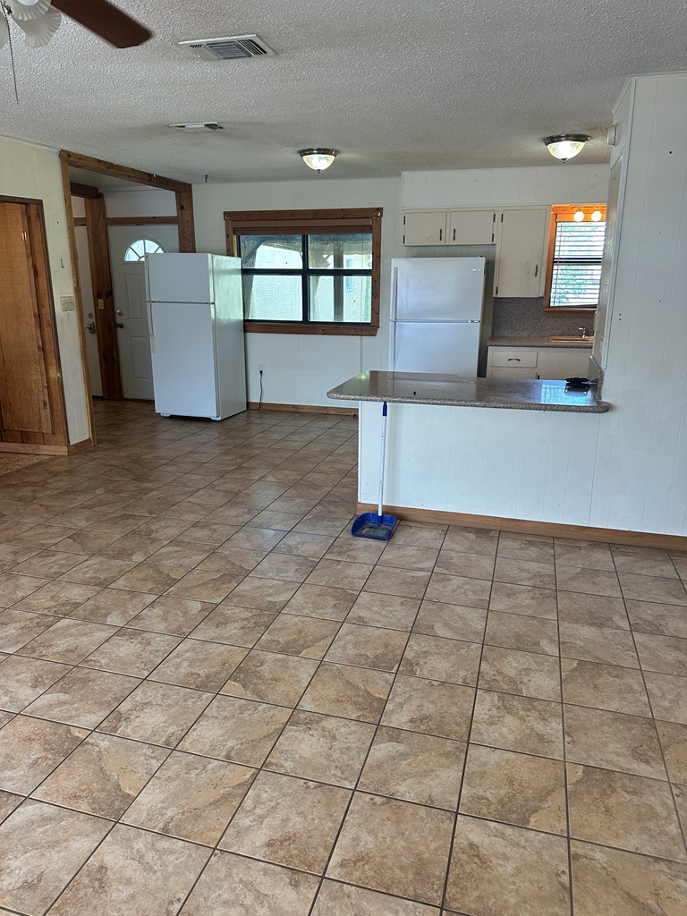 104 South Ave B Mason, TX 76856 - Photo 14 of 26 a view of empty room with cabinet and window