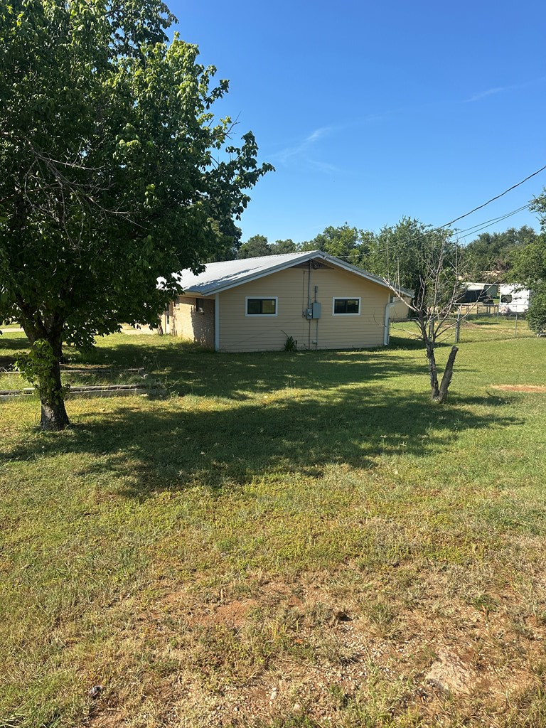 104 South Ave B Mason, TX 76856 - Photo 3 of 26 a front view of a house with a yard