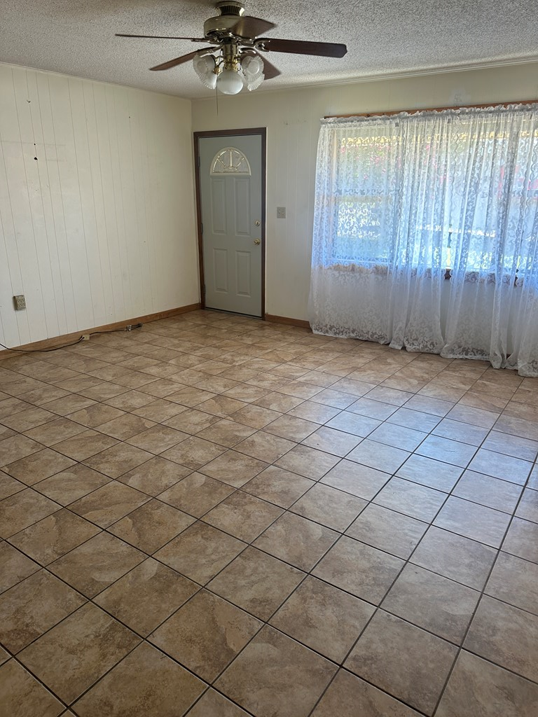 104 South Ave B Mason, TX 76856 - Photo 7 of 26 an empty room with windows