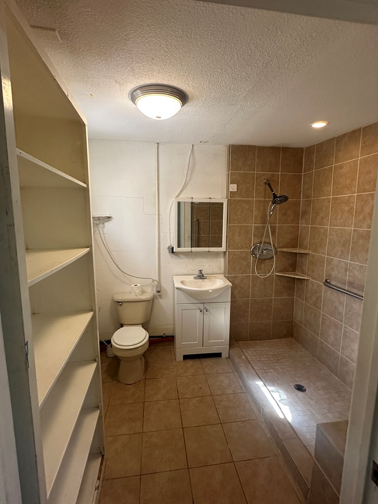 104 South Ave B Mason, TX 76856 - Photo 8 of 26 a bathroom with a toilet sink and shower