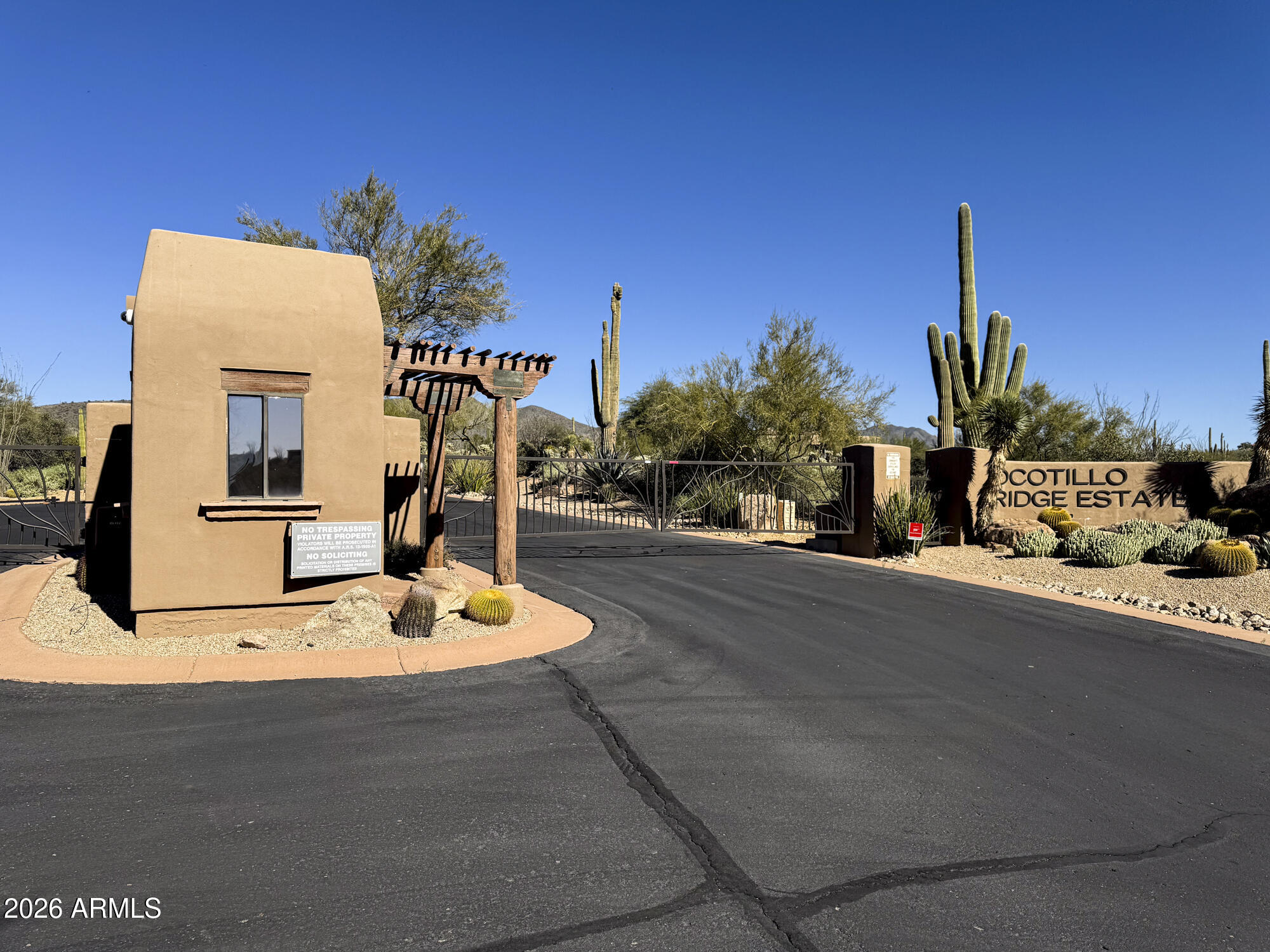 38853 North Ocotillo Ridge Drive, Unit 20 Carefree, AZ 85377 - Photo 14 of 21 a front view of a house with a yard