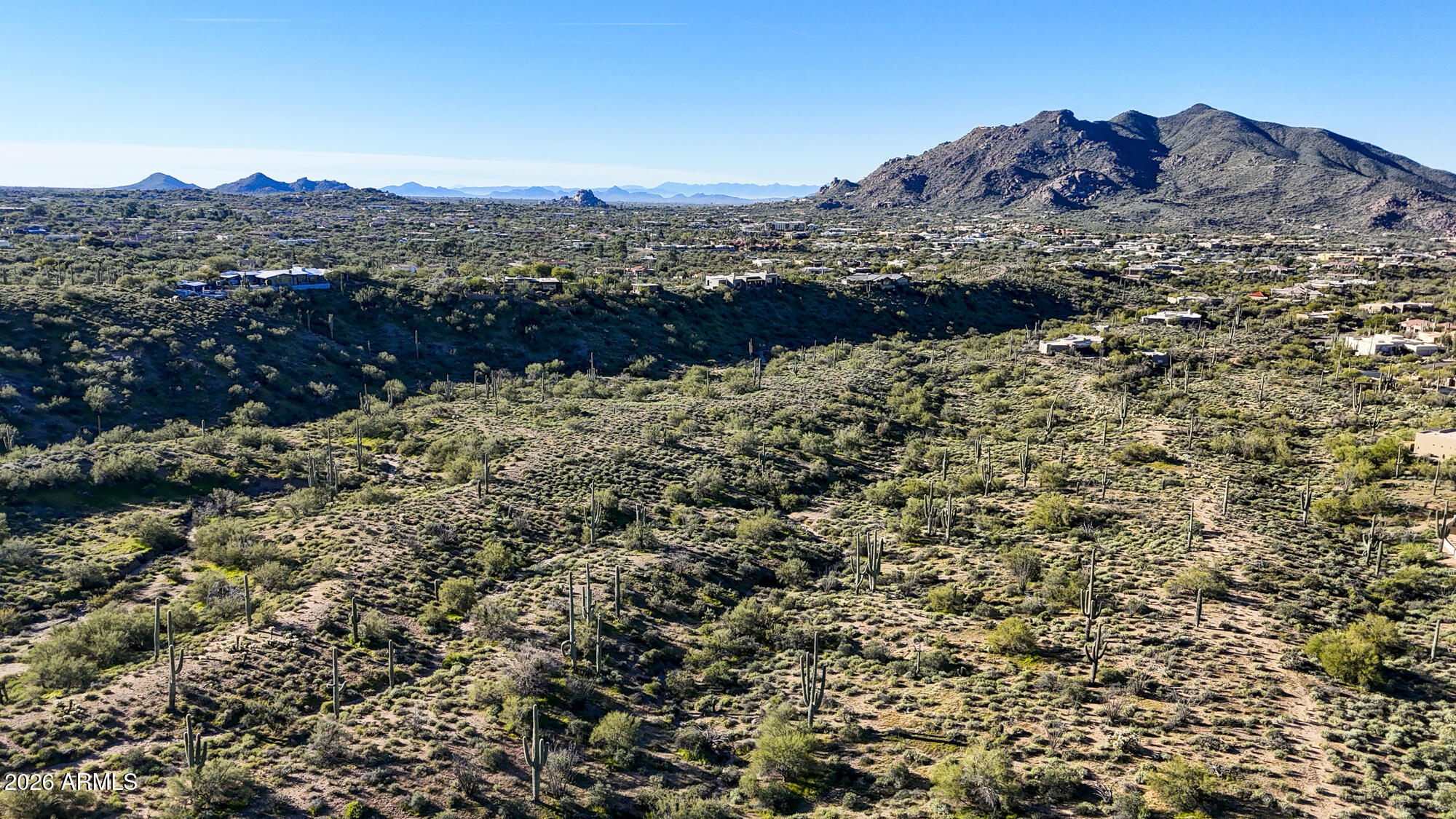 38853 North Ocotillo Ridge Drive, Unit 20 Carefree, AZ 85377 - Photo 4 of 21 a view of a dry yard with mountains in the background