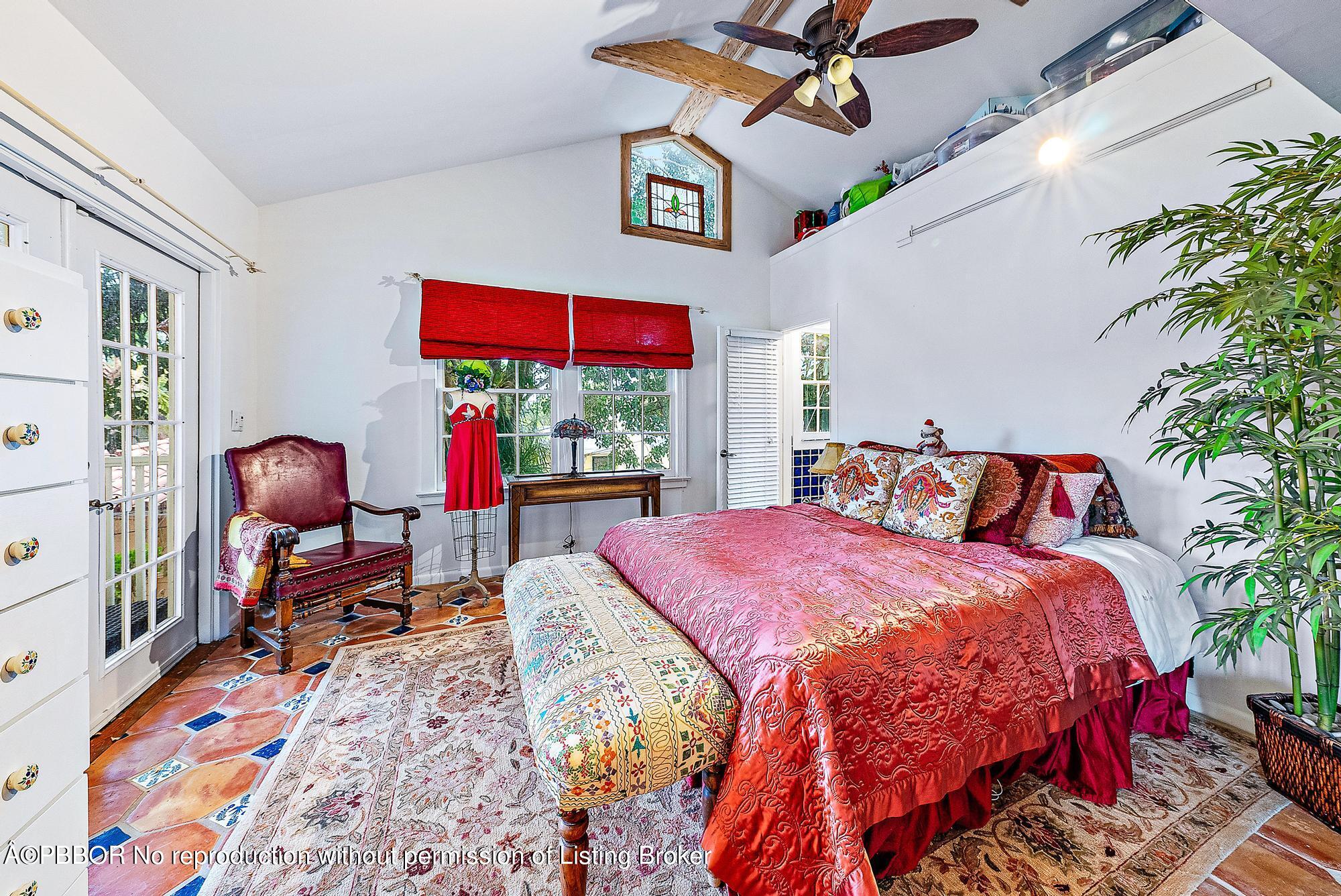 3609 Washington Road West Palm Beach, FL 33405 - Photo 15 of 33 a bed sitting in a bedroom next to a window