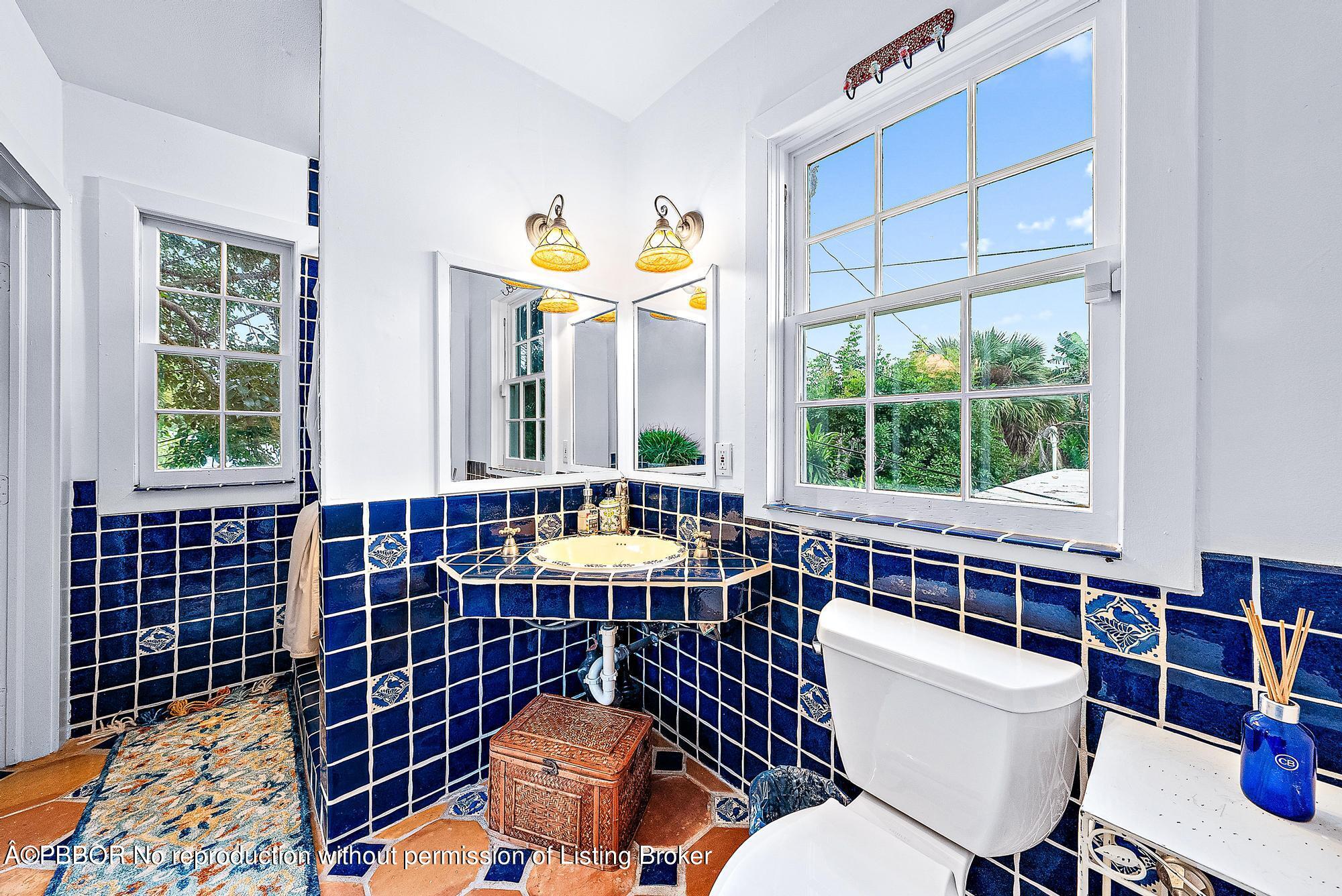 3609 Washington Road West Palm Beach, FL 33405 - Photo 19 of 33 a view of a dining room with furniture a chandelier and wooden floor