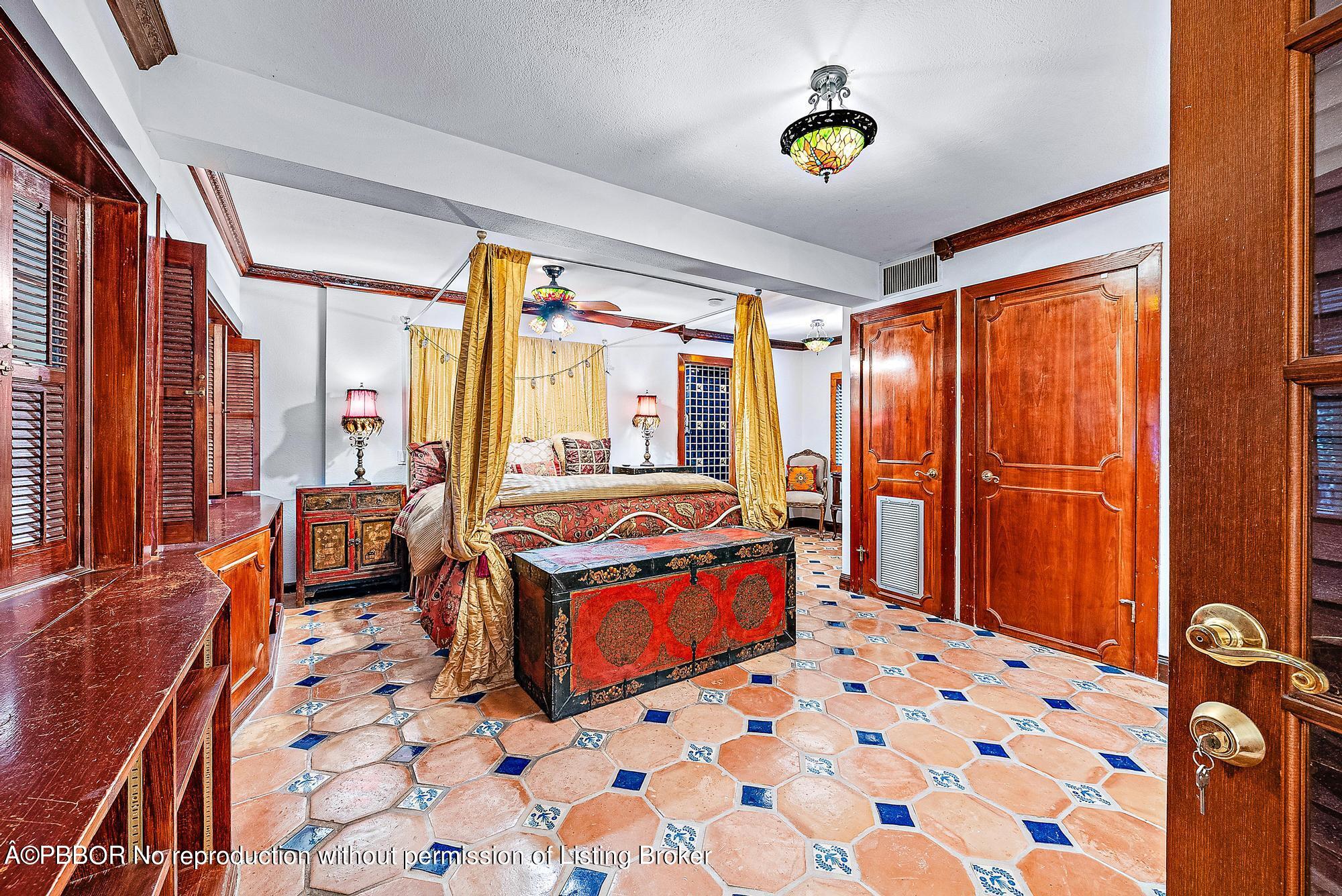 3609 Washington Road West Palm Beach, FL 33405 - Photo 22 of 33 a bedroom with balcony and bed