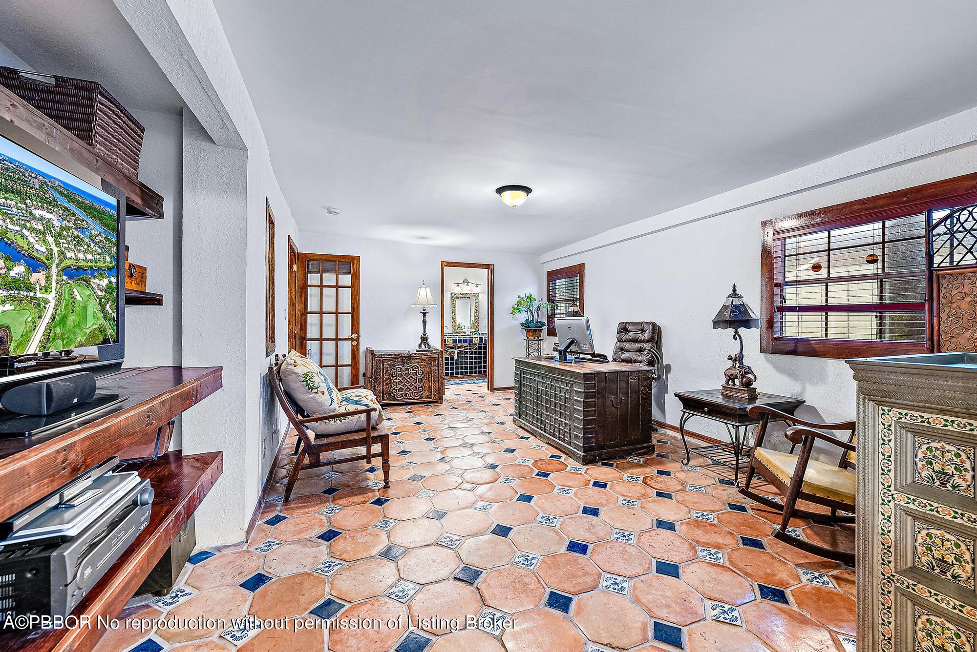 3609 Washington Road West Palm Beach, FL 33405 - Photo 26 of 33 a living room with furniture and a flat screen tv
