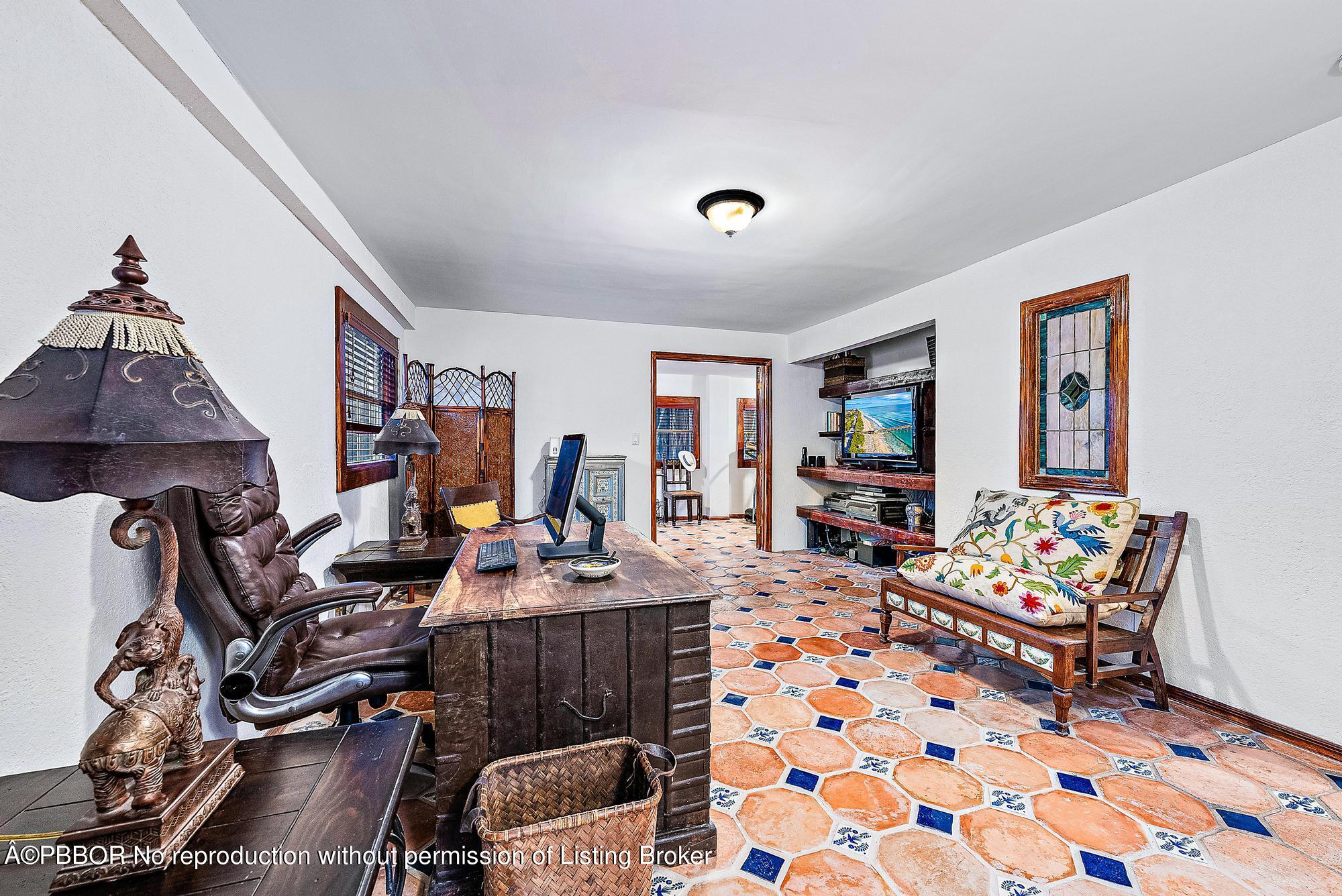 3609 Washington Road West Palm Beach, FL 33405 - Photo 27 of 33 a work room with furniture and wooden floor