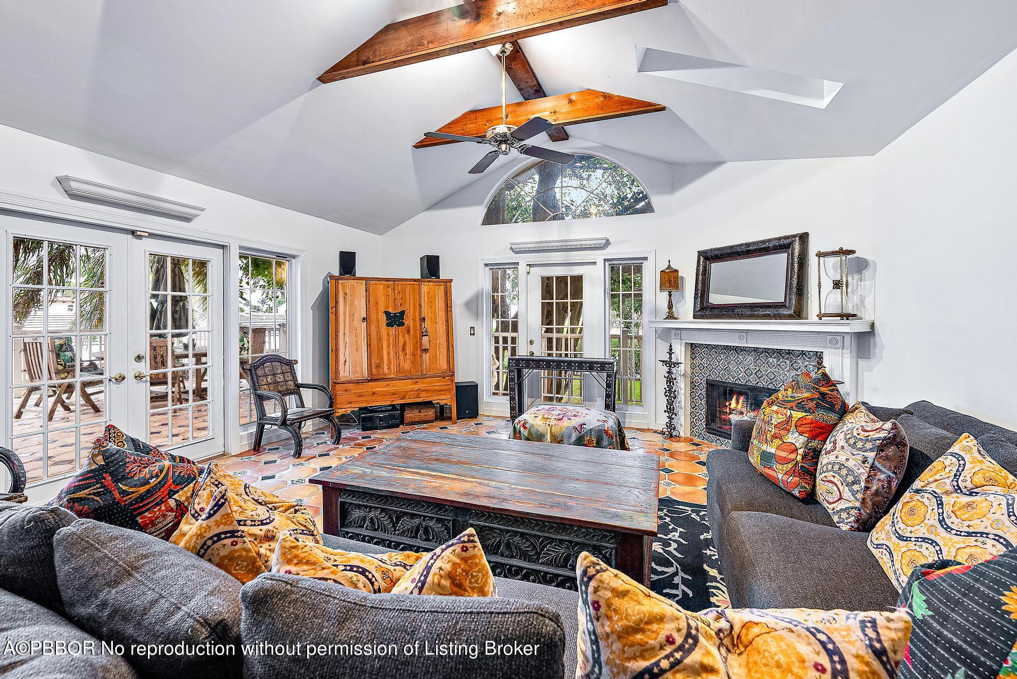 3609 Washington Road West Palm Beach, FL 33405 - Photo 6 of 33 a living room with furniture a rug and a fireplace