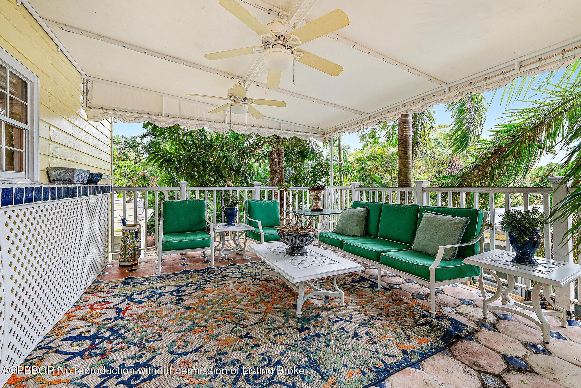 3609 Washington Road West Palm Beach, FL 33405 - Photo 8 of 33 a view of a chairs and table in backyard of a house