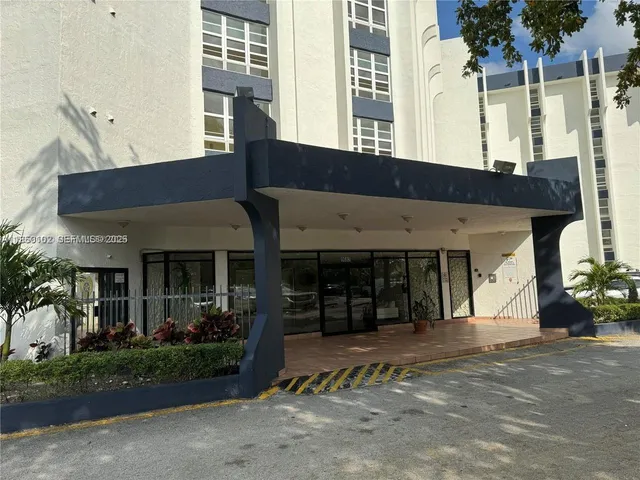 a front view of a building with garden