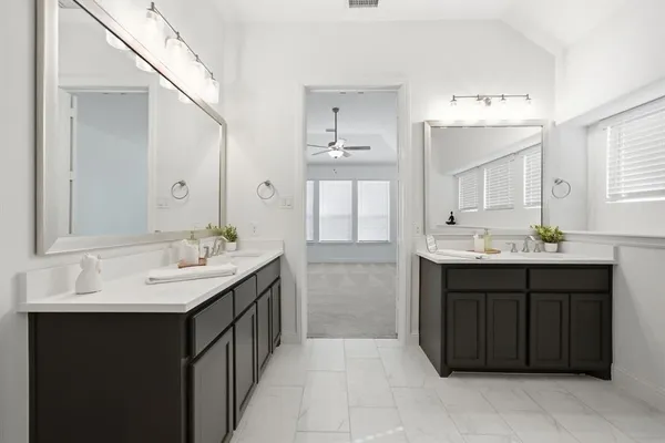 a bathroom with a sink a shower and a bathtub