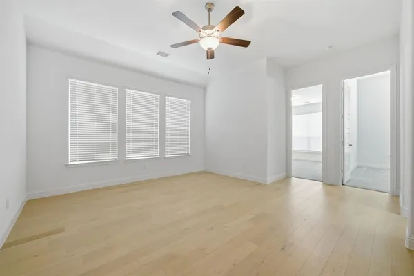 an empty room with closet and bathroom