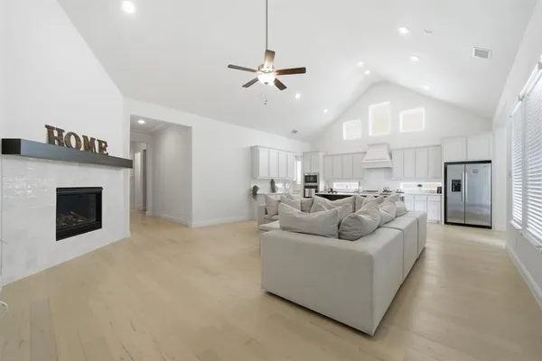 a living room with furniture and a fireplace