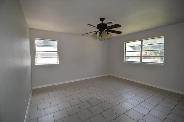 an empty room that has a window in it