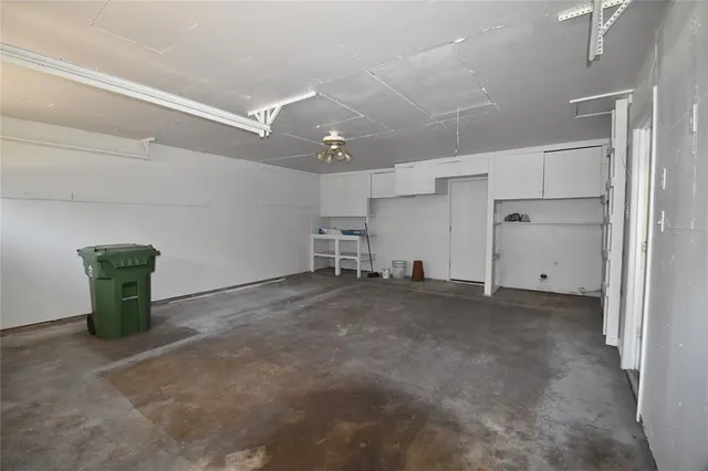 a view of a livingroom with furniture and a ceiling fan