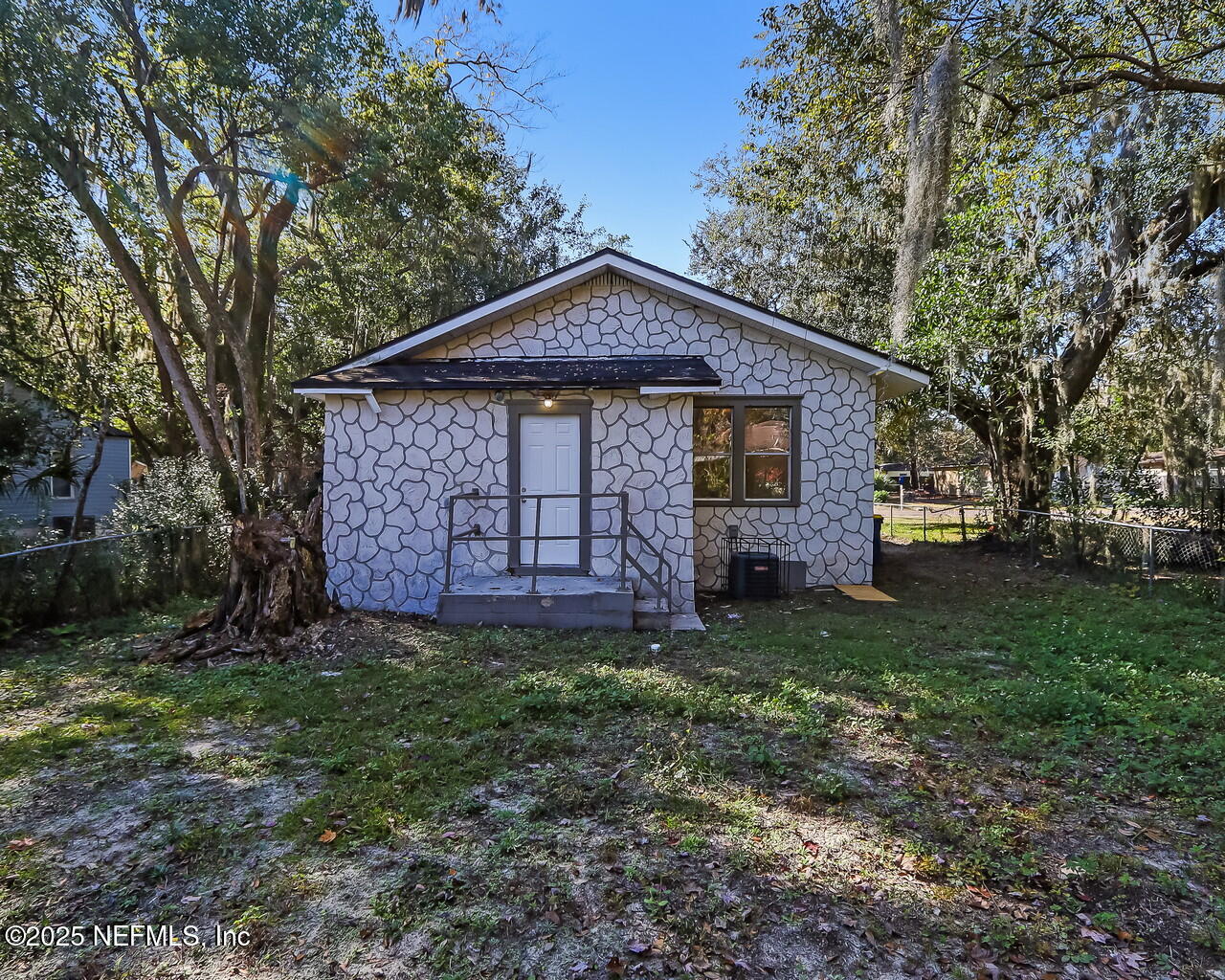 8951 6th Avenue Jacksonville, FL 32208 - Photo 27 of 29 a front view of a house with a garden