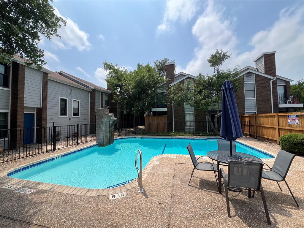 7635 Guadalupe Street, Unit 1002 Austin, TX 78752 - Photo 27 of 27 a view of a house with backyard and sitting area